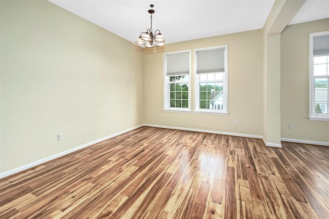 36 Bellefair Rd, Rye Brook, NY 10573 - empty room with a chandelier and hardwood / wood-style flooring