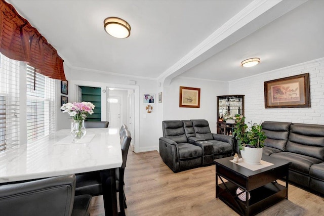 735 E 216th St, Bronx, NY 10467 - living area featuring light wood finished floors, ornamental molding, and baseboards