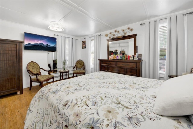 735 E 216th St, Bronx, NY 10467 - bedroom with multiple windows, wood finished floors, and crown molding