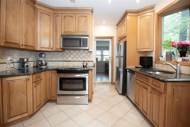 1053 Quentin Pl, Woodmere, NY 11598 - kitchen featuring stainless steel appliances, a sink, dark stone countertops, backsplash, and recessed lighting