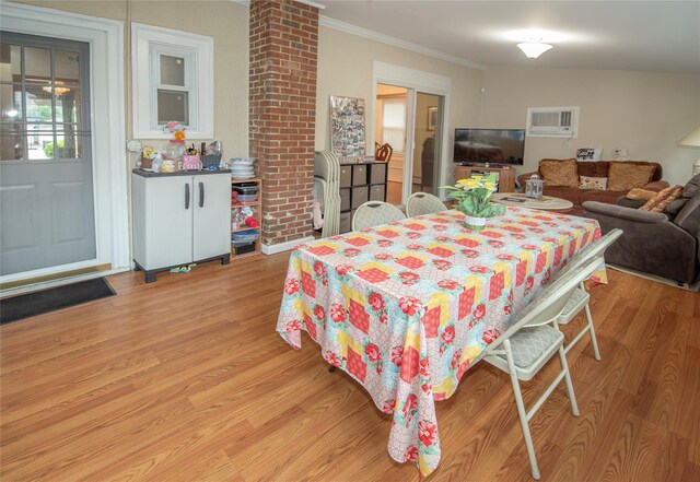 1053 Quentin Pl, Woodmere, NY 11598 - dining area with light wood-style flooring and ornamental molding