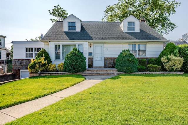 1158 Lorraine Dr, Franklin Square, NY 11010 - cape cod-style house featuring stone siding, a front yard, a chimney, and a shingled roof