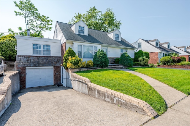 1158 Lorraine Dr, Franklin Square, NY 11010 - cape cod-style house featuring concrete driveway, an attached garage, stone siding, and a front yard