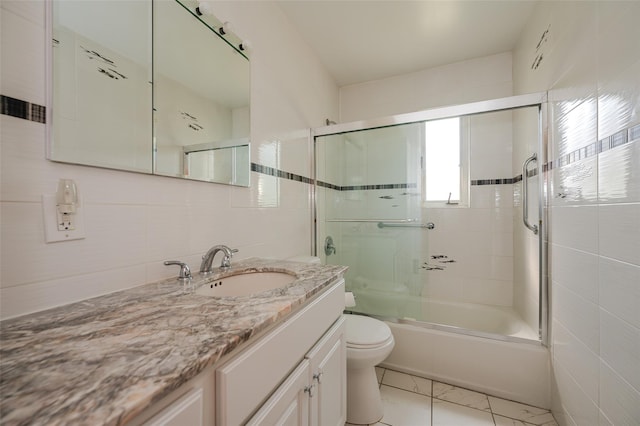 1158 Lorraine Dr, Franklin Square, NY 11010 - full bathroom featuring vanity, toilet, enclosed tub / shower combo, and tile walls