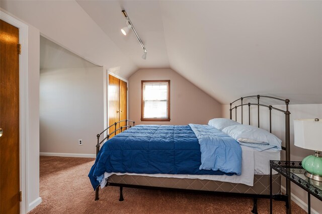 1158 Lorraine Dr, Franklin Square, NY 11010 - carpeted bedroom with track lighting, lofted ceiling, and baseboards