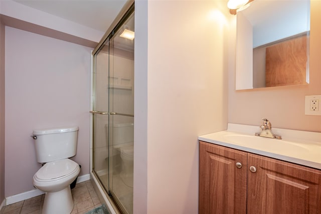 1158 Lorraine Dr, Franklin Square, NY 11010 - bathroom with toilet, vanity, a shower stall, tile patterned floors, and baseboards