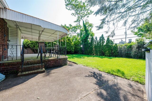 1158 Lorraine Dr, Franklin Square, NY 11010 - view of green lawn with a patio