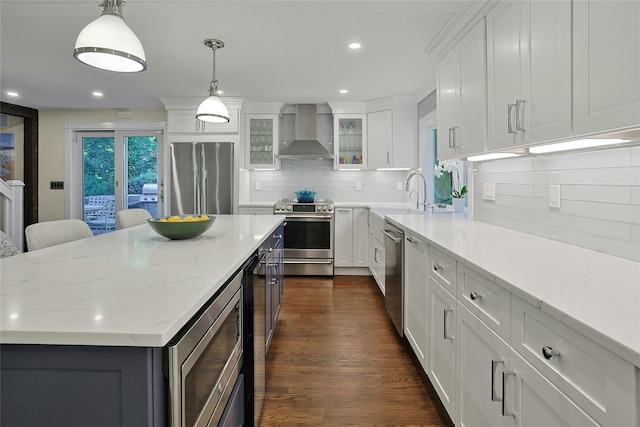 1 Lakeview Rd, South Salem, NY 10590 - kitchen featuring stainless steel appliances, wall chimney exhaust hood, white cabinets, decorative backsplash, and recessed lighting