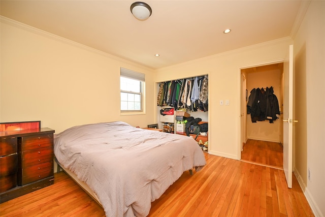 69-27 210th St Unit 2, Oakland Gardens, NY 11364 - bedroom featuring light wood finished floors, crown molding, baseboards, recessed lighting, and a closet