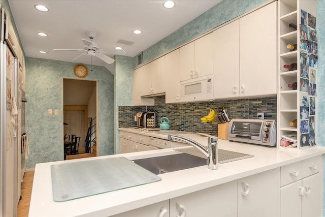 1055 Cedarhurst St, North Woodmere, NY 11581 - kitchen featuring white microwave, a ceiling fan, light countertops, a sink, and recessed lighting