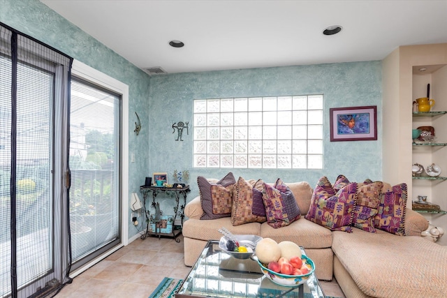 1055 Cedarhurst St, North Woodmere, NY 11581 - living area featuring plenty of natural light and tile patterned flooring