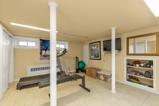 1055 Cedarhurst St, North Woodmere, NY 11581 - exercise room featuring tile patterned floors, baseboards, and radiator