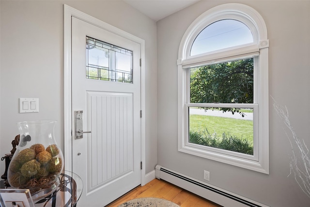 801 Syska Rd, Ossining, NY 10562 - foyer entrance featuring a baseboard radiator and light wood-style flooring