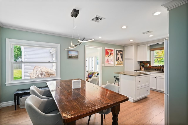 801 Syska Rd, Ossining, NY 10562 - dining room featuring ornamental molding, light wood-type flooring, baseboards, and recessed lighting