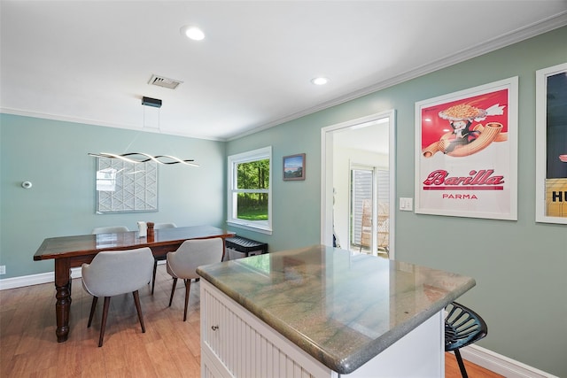 801 Syska Rd, Ossining, NY 10562 - kitchen featuring light wood-style floors, ornamental molding, baseboards, white cabinetry, and recessed lighting
