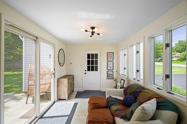 801 Syska Rd, Ossining, NY 10562 - sunroom featuring a chandelier, baseboards, and tile patterned flooring
