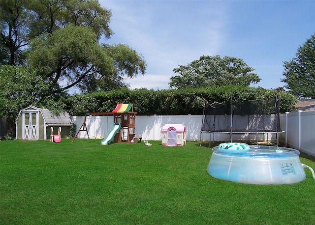 31 Saint Joseph Ave, Ronkonkoma, NY 11779 - view of yard with a trampoline and a playground