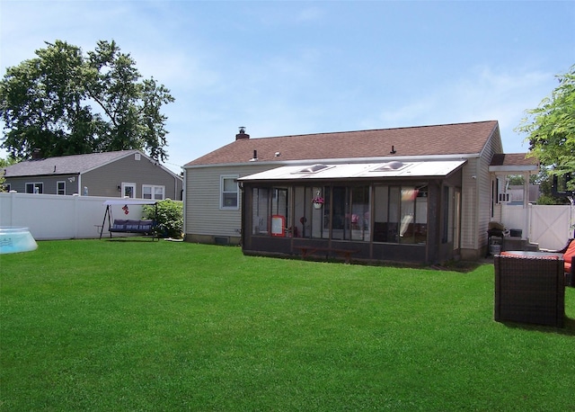 31 Saint Joseph Ave, Ronkonkoma, NY 11779 - back of house featuring a sunroom and a chimney