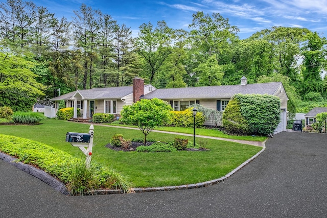 8 Bridle Path Rd, Smithtown, NY 11787 - ranch-style home featuring a chimney and a front lawn