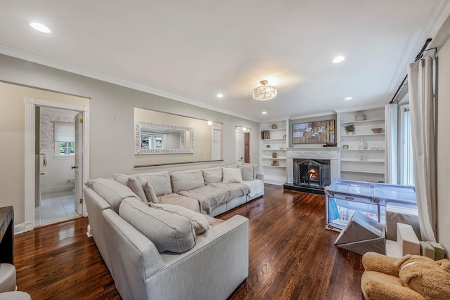 8 Bridle Path Rd, Smithtown, NY 11787 - living area with dark wood-type flooring, a lit fireplace, recessed lighting, ornamental molding, and baseboards
