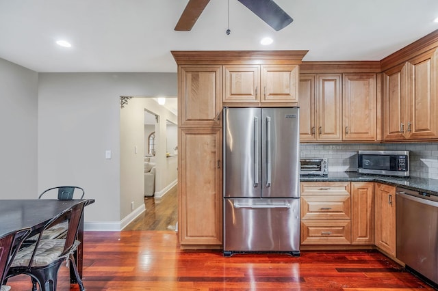 8 Bridle Path Rd, Smithtown, NY 11787 - kitchen featuring stainless steel appliances, dark wood-type flooring, baseboards, tasteful backsplash, and a ceiling fan