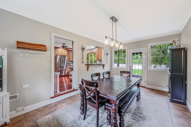 8 Bridle Path Rd, Smithtown, NY 11787 - tiled dining space with crown molding, baseboards, and ceiling fan