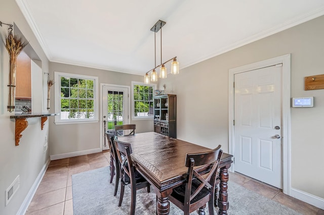 8 Bridle Path Rd, Smithtown, NY 11787 - dining space with crown molding, light tile patterned floors, and baseboards
