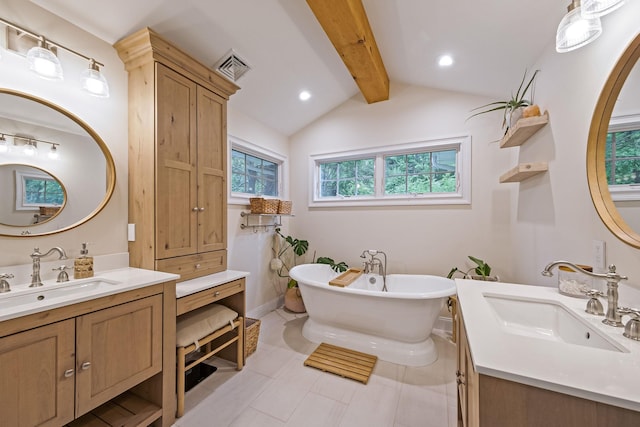 8 Bridle Path Rd, Smithtown, NY 11787 - bathroom featuring two vanities, a freestanding bath, and tile patterned flooring