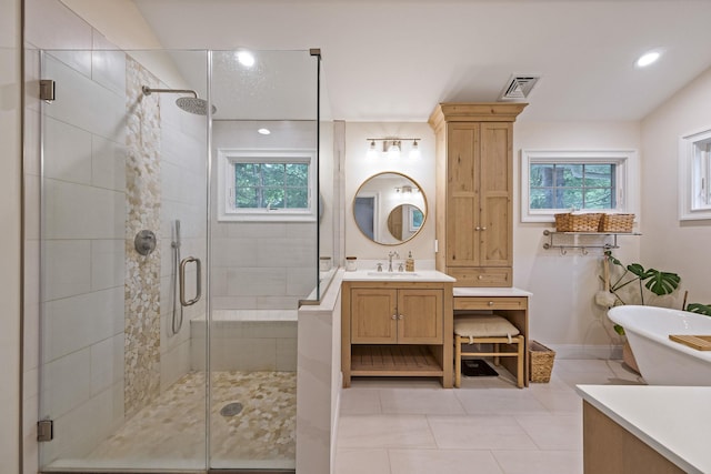 8 Bridle Path Rd, Smithtown, NY 11787 - full bathroom with a shower stall, vanity, healthy amount of natural light, a soaking tub, and recessed lighting