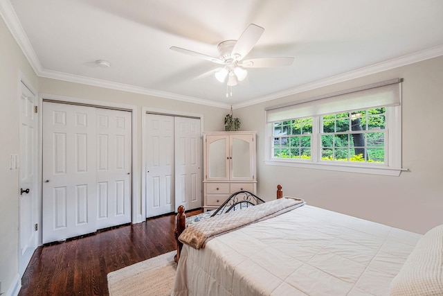 8 Bridle Path Rd, Smithtown, NY 11787 - bedroom featuring two closets, wood finished floors, crown molding, and ceiling fan
