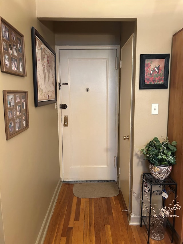 110-20 71st Ave Unit 411, Forest Hills, NY 11375 - doorway featuring wood finished floors and baseboards