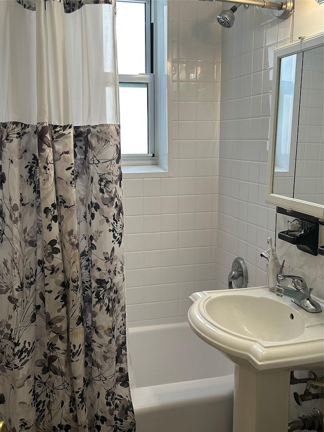 110-20 71st Ave Unit 411, Forest Hills, NY 11375 - bathroom featuring shower / bathtub combination with curtain, tasteful backsplash, and tile walls