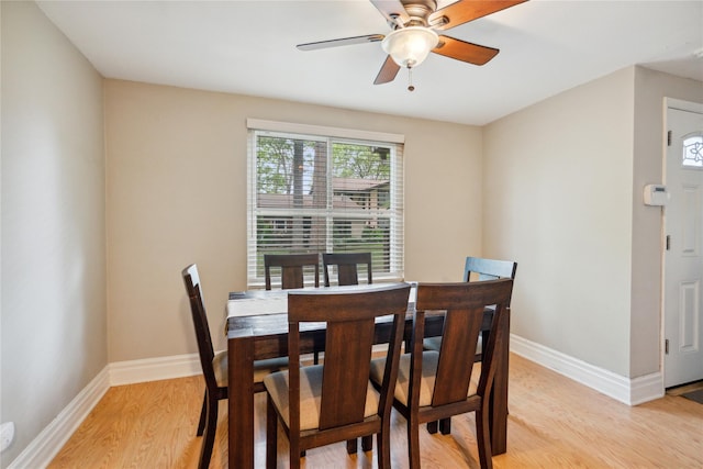 65 Sagamore Hills Dr, Port Jefferson Station, NY 11776 - dining room with light wood-style flooring, baseboards, and ceiling fan