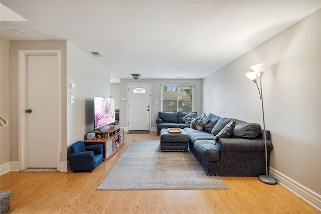 65 Sagamore Hills Dr, Port Jefferson Station, NY 11776 - living room featuring wood finished floors and baseboards