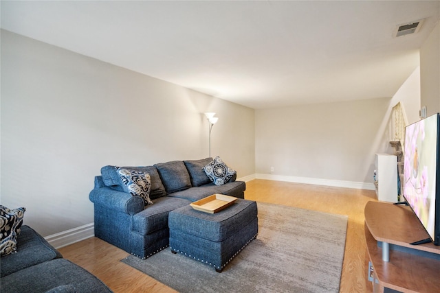 65 Sagamore Hills Dr, Port Jefferson Station, NY 11776 - living area featuring light wood-style flooring and baseboards