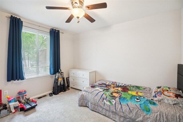 65 Sagamore Hills Dr, Port Jefferson Station, NY 11776 - carpeted bedroom with ceiling fan and baseboards