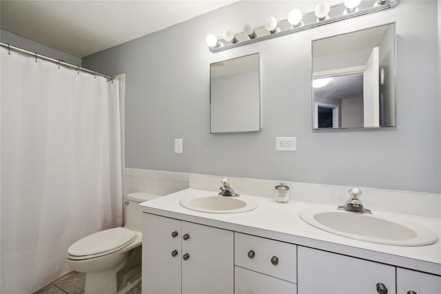 65 Sagamore Hills Dr, Port Jefferson Station, NY 11776 - full bath featuring double vanity, toilet, a shower with shower curtain, and tile patterned flooring