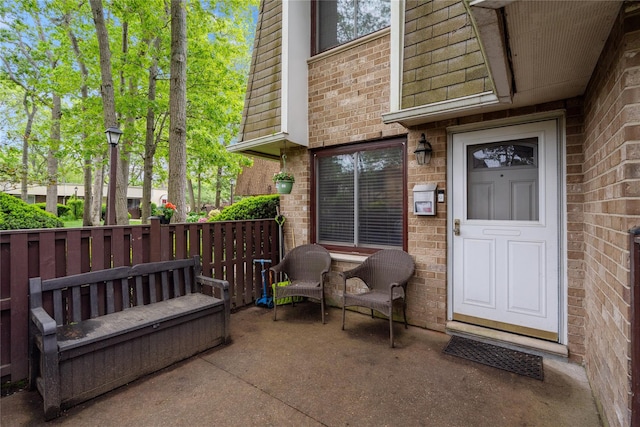 65 Sagamore Hills Dr, Port Jefferson Station, NY 11776 - property entrance featuring brick siding and mansard roof
