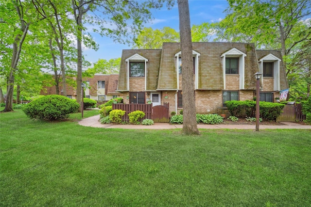 65 Sagamore Hills Dr, Port Jefferson Station, NY 11776 - view of front of house with mansard roof and brick siding