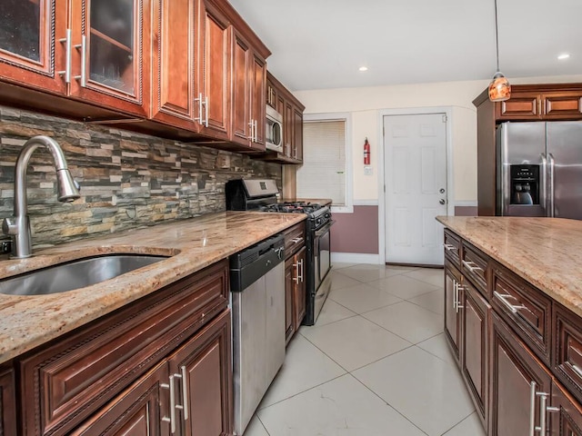 3333 Tiemann Ave, Bronx, NY 10469 - kitchen featuring stainless steel appliances, a sink, backsplash, light stone countertops, and recessed lighting
