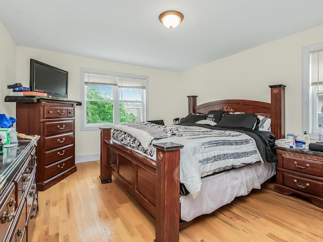 3333 Tiemann Ave, Bronx, NY 10469 - bedroom with light wood-type flooring and baseboards