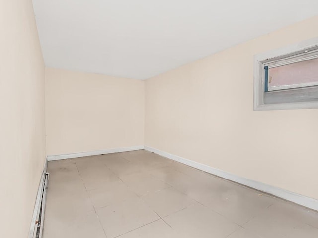 3333 Tiemann Ave, Bronx, NY 10469 - empty room featuring baseboards and a baseboard heating unit