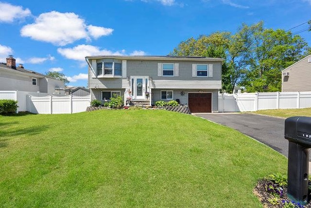 105 Fountain Ave, Selden, NY 11784 - raised ranch featuring a garage and asphalt driveway