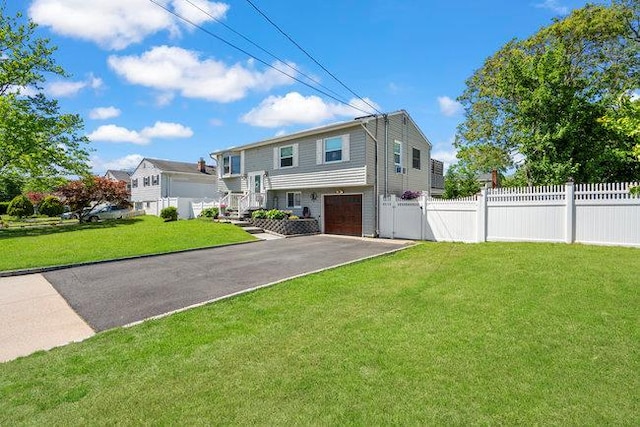 105 Fountain Ave, Selden, NY 11784 - raised ranch with an attached garage and asphalt driveway