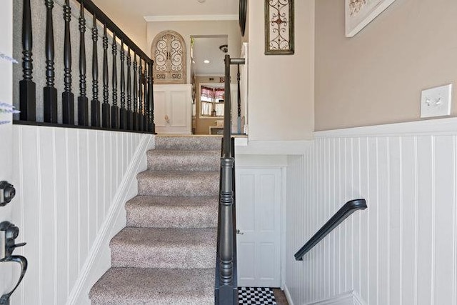 105 Fountain Ave, Selden, NY 11784 - staircase featuring a decorative wall, a wainscoted wall, and ornamental molding