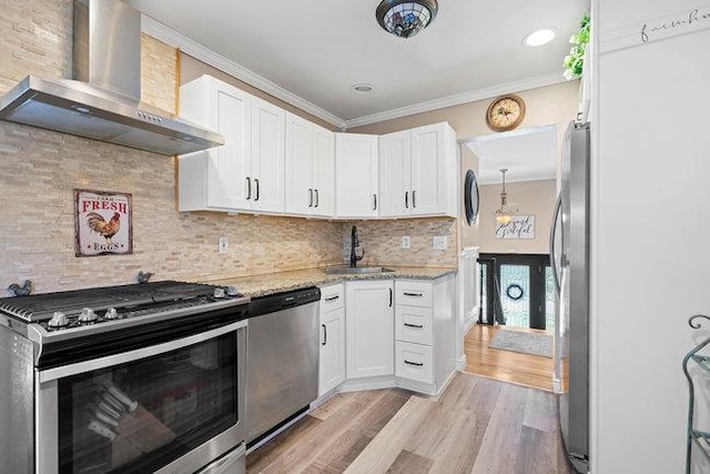 105 Fountain Ave, Selden, NY 11784 - kitchen featuring stainless steel appliances, wall chimney range hood, a sink, ornamental molding, and light stone counters