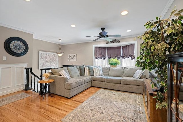 105 Fountain Ave, Selden, NY 11784 - living room with ornamental molding, light wood-style floors, a ceiling fan, and recessed lighting