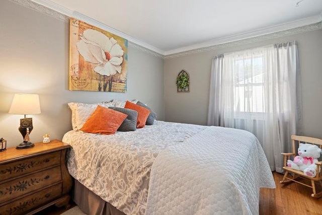 105 Fountain Ave, Selden, NY 11784 - bedroom with ornamental molding and wood finished floors