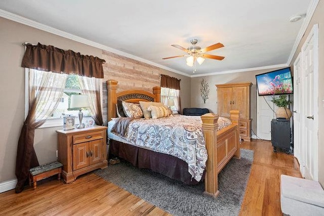 105 Fountain Ave, Selden, NY 11784 - bedroom with light wood finished floors, crown molding, and a ceiling fan