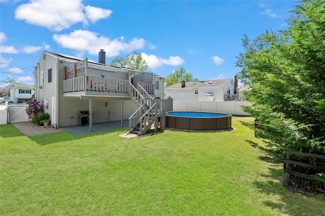 105 Fountain Ave, Selden, NY 11784 - rear view of property with a gate, a wooden deck, stairs, a chimney, and a patio
